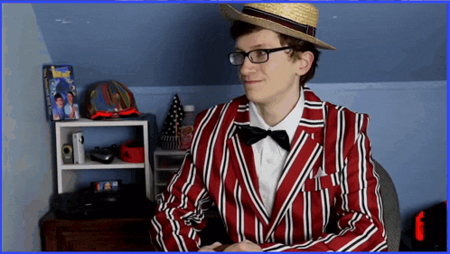 a man in a red and white striped jacket and hat