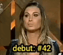 a woman is standing in front of a sign that says `` debut # 42 '' .