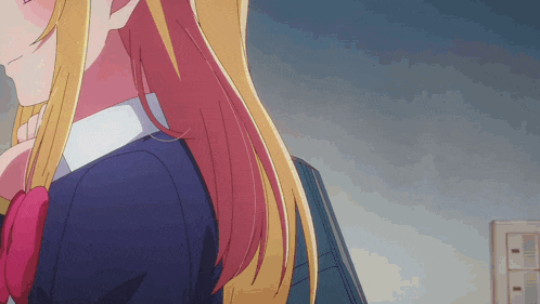 a girl with long blonde hair is wearing a blue jacket and a red bow tie