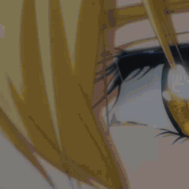 a close up of a person 's eye with a yellow eyebrow