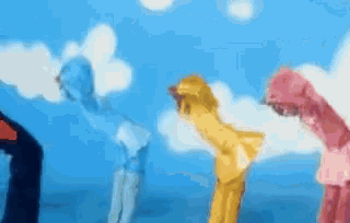 a blurry picture of three people standing in front of a blue sky