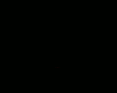 a close up of a pair of red eyes in the dark