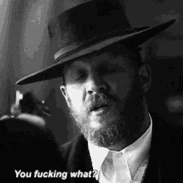 a man with a beard is wearing a hat and says you fucking what