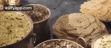 there are many different types of food in the pots and pans .