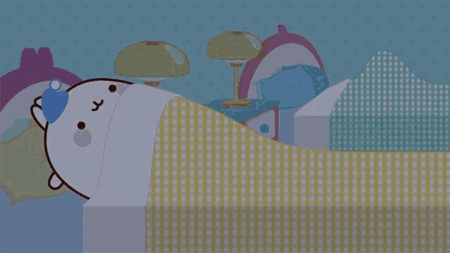 a cartoon of a cat sleeping in a bed with a checkered blanket