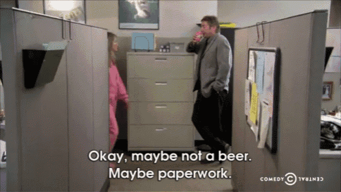 a man in an office cubicle says " okay maybe not a beer "