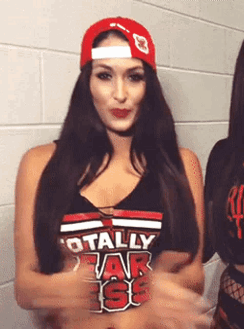 a woman wearing a hat and a shirt that says totally star iss