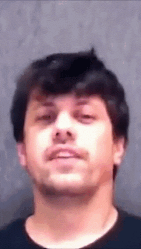a close up of a man 's face with his eyes closed