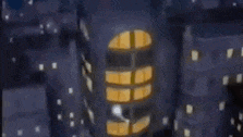 a close up of a black and blue object with a white triangle on it