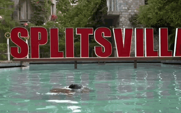 a person is swimming in a pool with the words splitsville in red letters