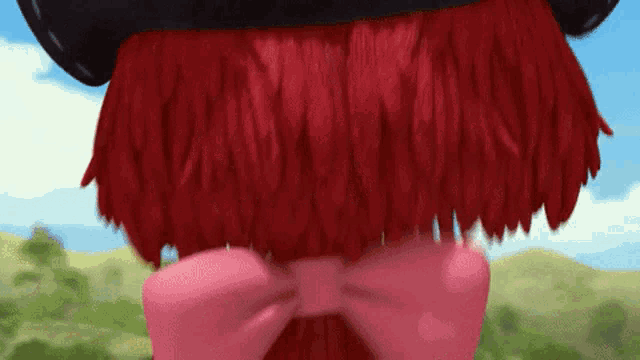 a cartoon character with red hair and a bow