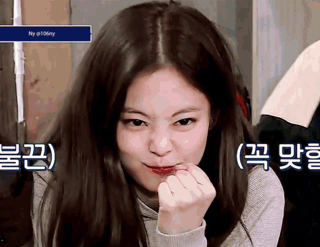 a girl with long hair is making a funny face in front of a screen that says ny @ 106my