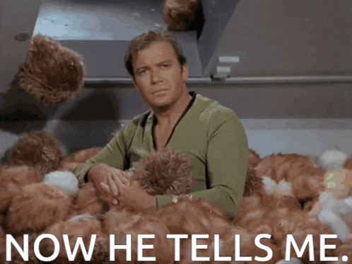 a man is sitting in a pile of stuffed animals with the words now he tells me