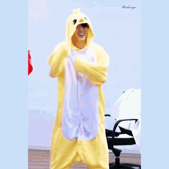 a person in a yellow and white duck costume