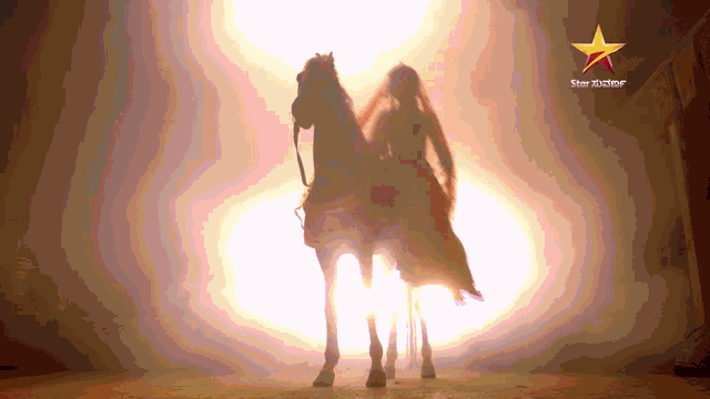 a silhouette of a woman riding a horse with a star that says star xtreme