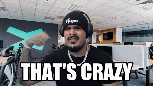 a man wearing a beanie and headphones says " that 's crazy "