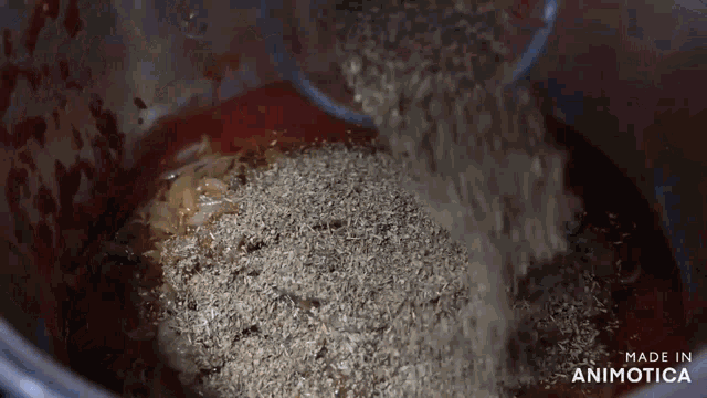 a close up of a pot of food with the words made in animotica on the bottom