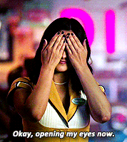 a woman covering her eyes with her hands with the words okay opening my eyes now