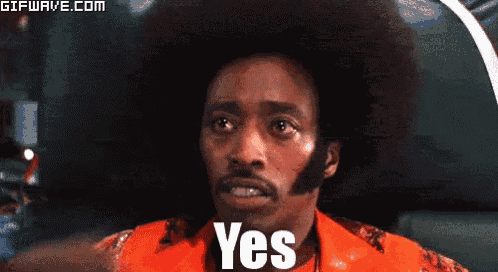 a man with a big afro says yes