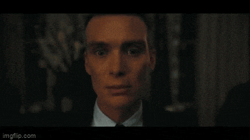 a close up of a man 's face with his eyes closed in a dark room .