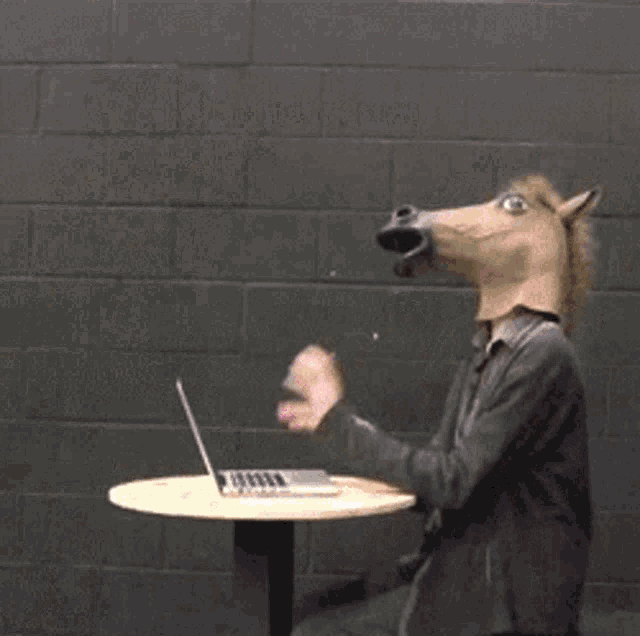 a woman with a blue bird on her head and a man with a horse head