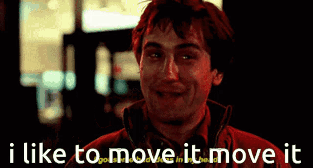 a man in a red jacket with the words i like to move it move it