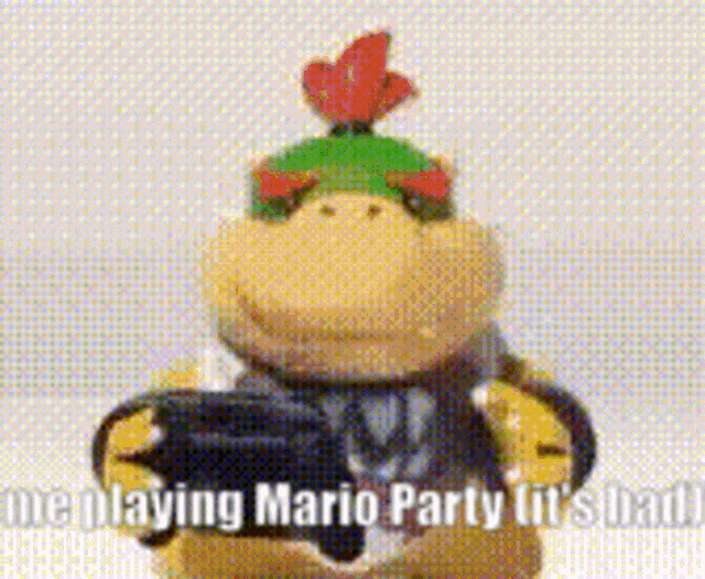 a stuffed animal is holding a video game controller and says me playing mario party it 's bad .