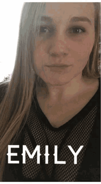 a close up of a woman 's face with emily written on the bottom