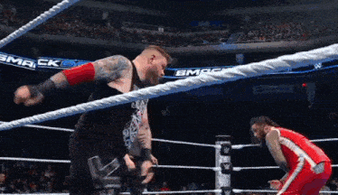 a wrestler in a ring with the word smack on the ropes