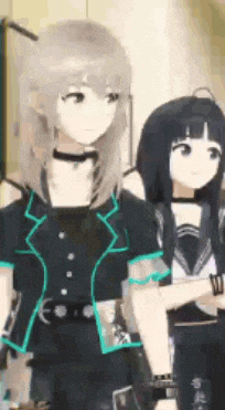 a couple of anime girls standing next to each other in a room .