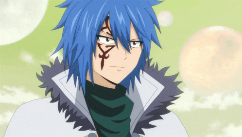 a man with blue hair has a tattoo on his forehead