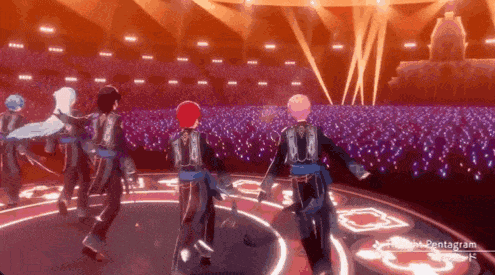 a group of people are dancing on a stage in front of a large crowd .