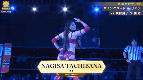 a female wrestler named nagisa tachibana is standing in a wrestling ring