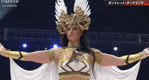 a woman in a gold and white costume with the word stardom on the bottom