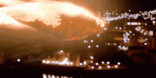 a blurred image of a fire with a few lights in the foreground