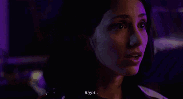 a close up of a woman 's face says right