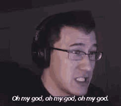 a man with glasses and headphones is making a funny face .