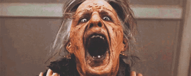 a close up of a woman with a scary face