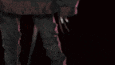 a blurry picture of a person with chinese writing on the bottom