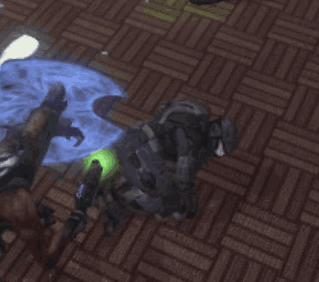 a person laying on the floor with a green light coming out of their hand