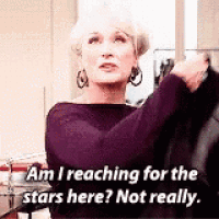 a woman in a purple dress is reaching for the stars here .