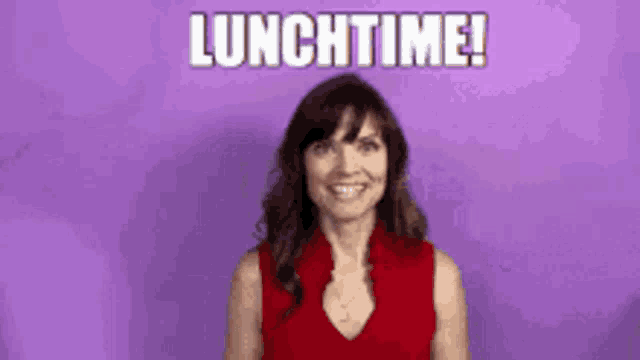 a woman in a red shirt is smiling and says lunchtime