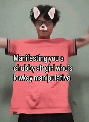 a man is wearing a pink shirt that says manifesting you a chubby alt girl who 's low key manipulative