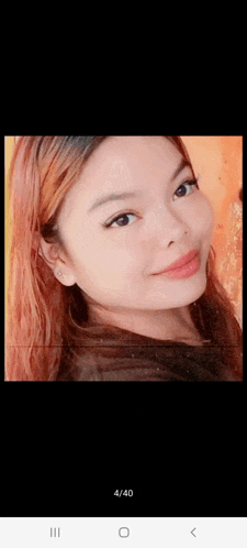 a close up of a woman 's face with the number 4 / 40 on the bottom right