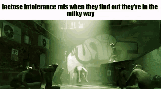 a group of people in a dark room with a sign that says lactose intolerance