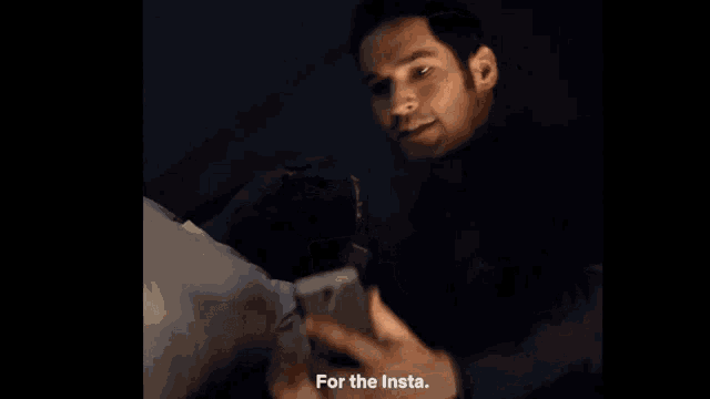 a man taking a picture of himself with a caption that says " for the insta "