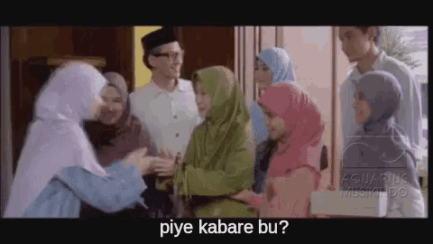 a group of people are standing next to each other and one of them is asking another person if they are okay .