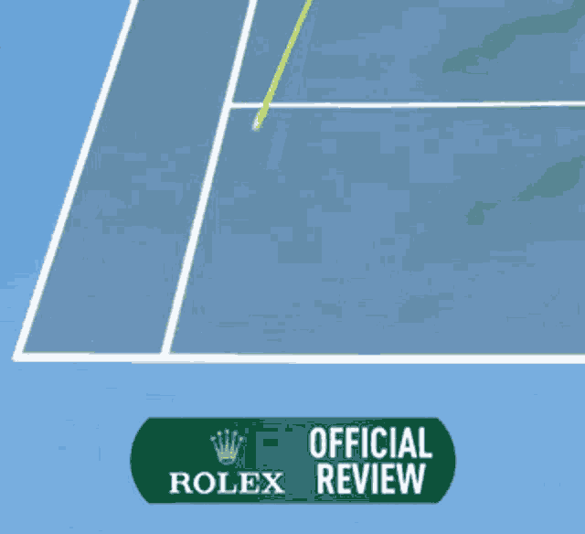 a tennis court with a sign that says rolex on it