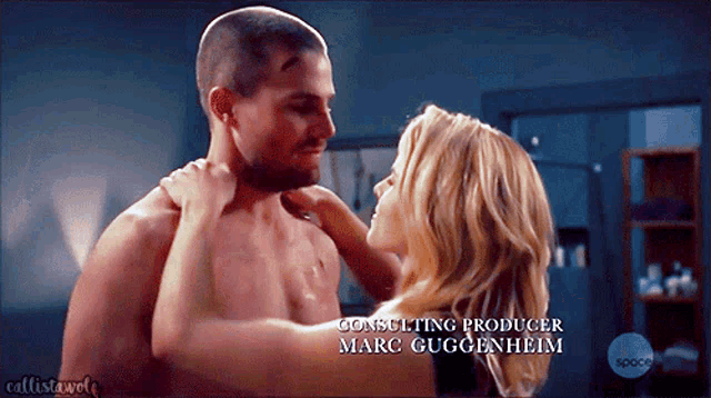 a man and a woman are kissing with the consulting producer marc guggenheim written below them