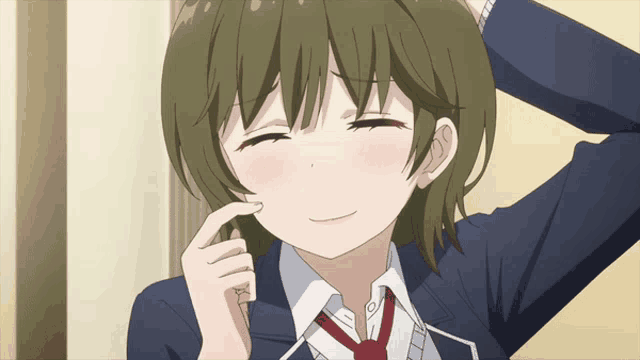 a girl in a blue jacket and red tie is smiling